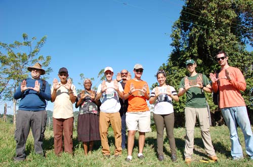 Manuel Moncholi (far left), Miami-Dade engineer and professional mentor, throws up the U alongside local villagers in the Dominican Republic, UM engineering students from UM’s Engineers without Borders (from left to right): Kyle Lombard, Nicholas Pelisek, Divya Bhansali, Oscar Qiu, and Drew Barhydt.