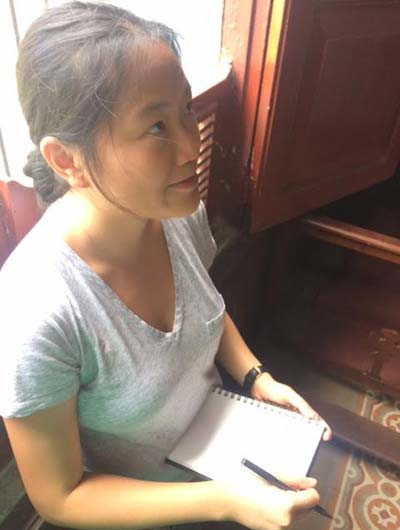 Lok Chan, UM architecture student, takes notes during a studio class in Santiago de Cuba.